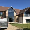 Glass Solutions, Indoor – Outdoor | ISWUK Ltd | Facias, Cladding & Soffits | Entrance Canopies | Balconies | Balustrades | Stairs | Decking